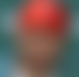 justin fields at a post game conference with a red hat with the number 7 logo in white