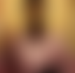 Jesus with his hand pointed up with the sun and its rays beaming behind him