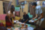 Nalu, Dennis, and Boyd fill their plates and share a laugh at dinner.