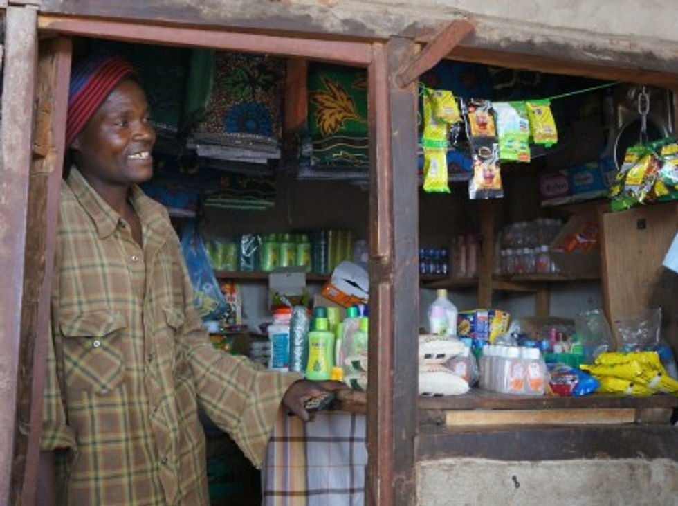 Brown Ngoma is expanding his family's store, building a home, and now "when his family is sick he can pay for a private hospital." (Manyamula, Malawi)