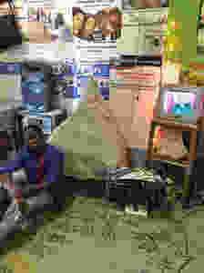 man posing with TV and radio system