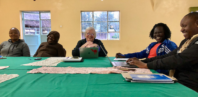 team members sitting around a table