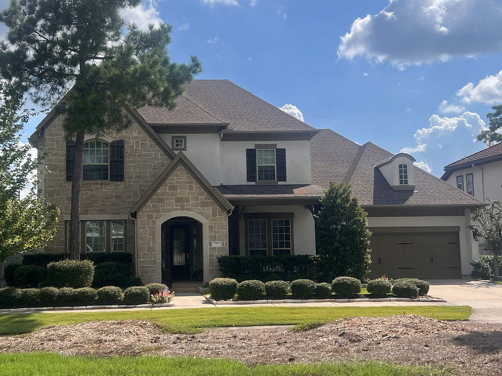 Stone and stucco home in Liberty branch in the village of Creekside Park in The Woodlands, Texas