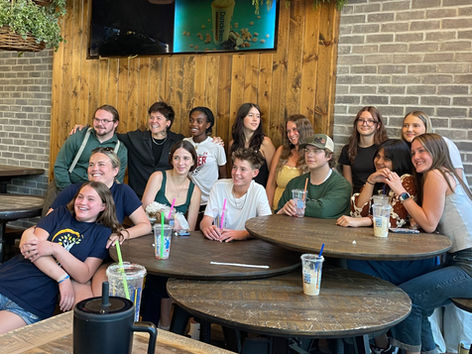 Lauren Hamilton and teens from the Teen Action Team pose for a group photo at Alive After 5.