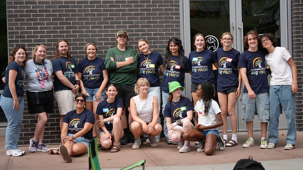 Lauren Hamilton and teens from the Teen Action Team pose for a group photo at Alive After 5.