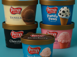 Tubs of Perry’s Ice Cream in assorted flavors—Strawberry, Chocolate, Vanilla, Panda Paws, and Cotton Candy—arranged on a turquoise background, with the Strawberry flavor in clear focus at the front.