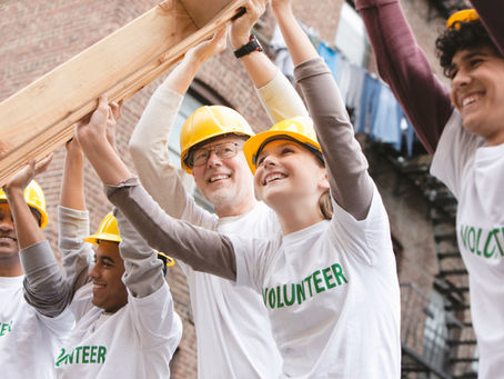 Volunteers working to build a house.