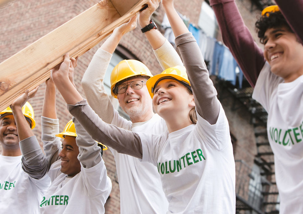 Volunteers working to build a house.
