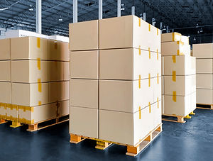 stack of cardboard boxes on wooden palle