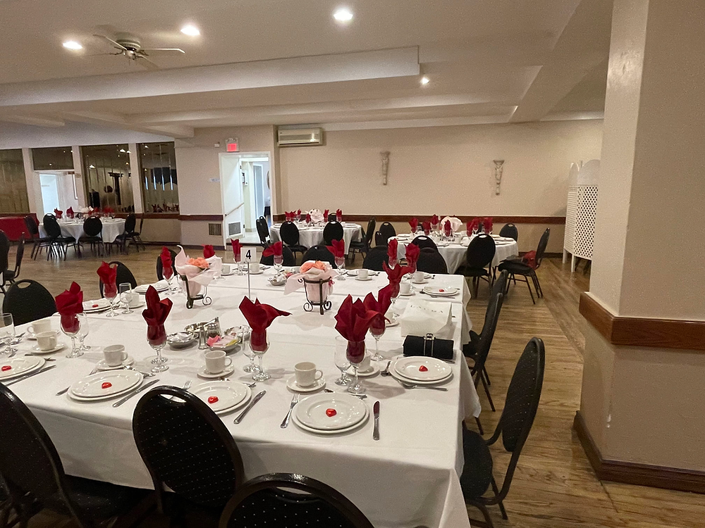 Banquet hall in Hamilton with tables and red napkins