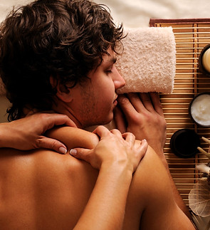 young-man-spa-treatment-recreation-rest-relaxation-massage-hygh-angle-view-scaled.jpg