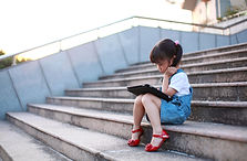 Girl Playing with Tablet