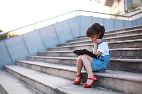 Girl Playing with Tablet