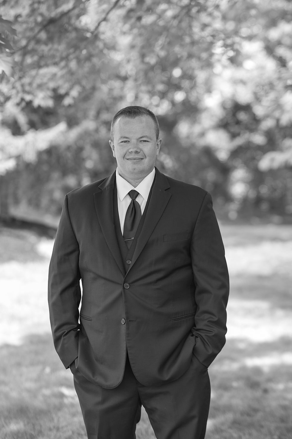 Groom in suit waiting to see bride on wedding day