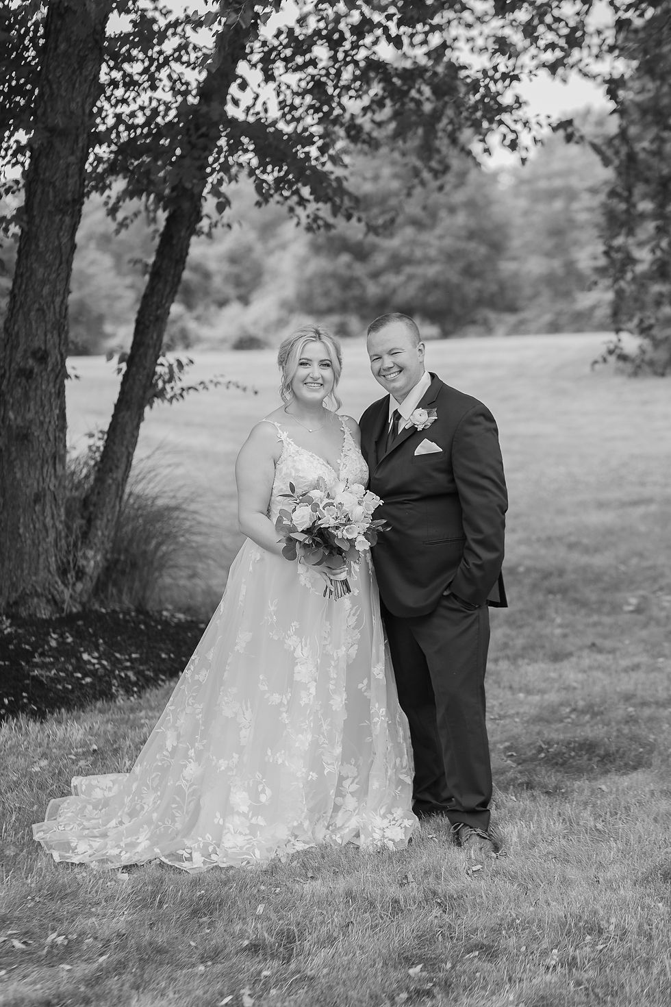 Black and white photo of bride and groom at first look
