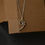 Thumbnail: "F-clef" pendant