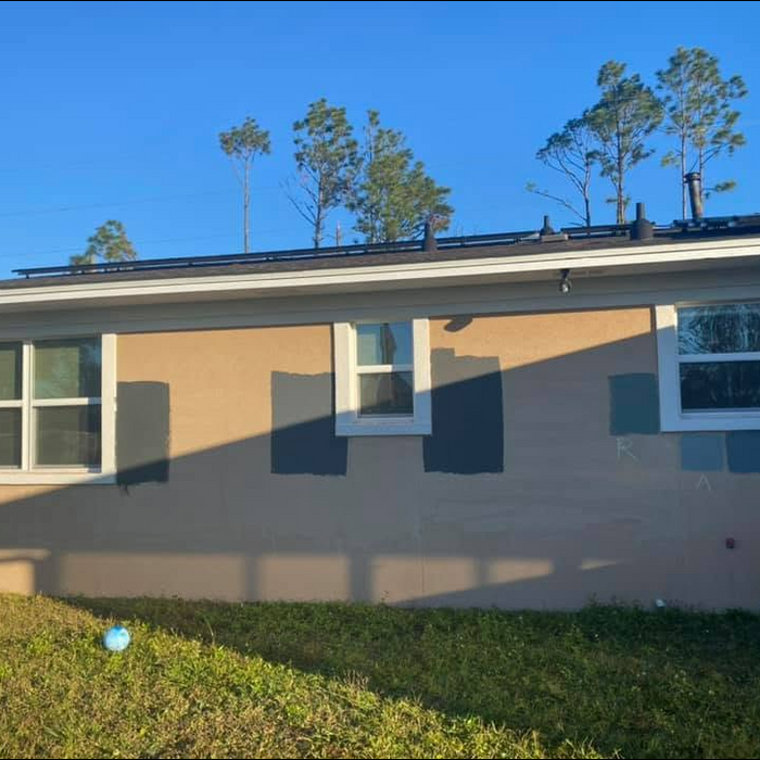 Tan stucco exterior on residential home completed by All Pro Stucco