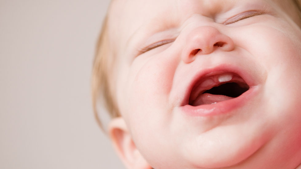 a baby showing signs of teething pain and discomfort