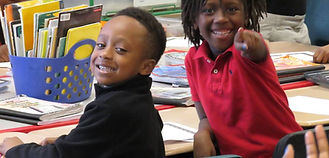 3rd graders smiling for the camera.