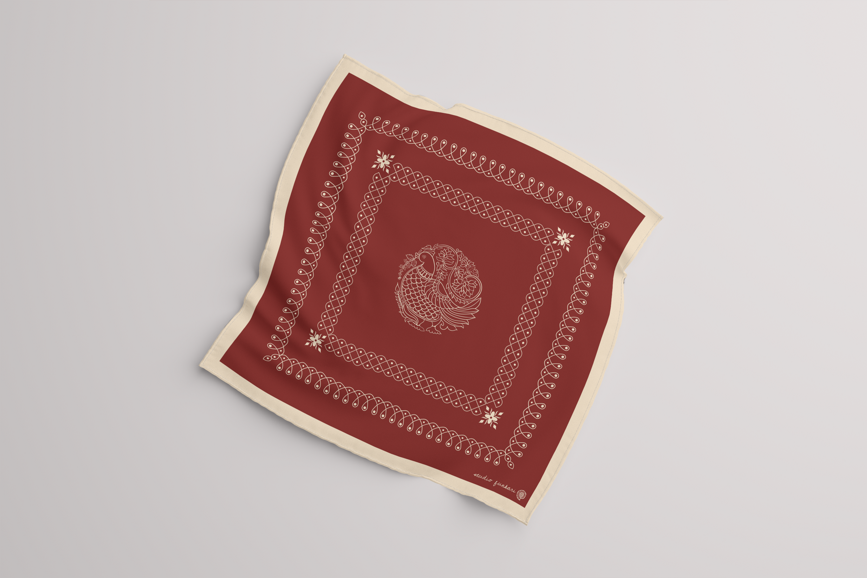 Studio Funkari kolam silk scarf in satin finish with hand-painted border, styled in studio light