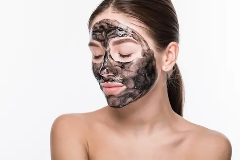 compressed_beautiful-woman-with-clay-mud-mask-her-face-isolated-white-wall.webp
