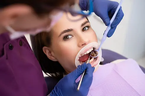 compressed_dentist-uses-dental-tools-and-mirror-to-check-the-2026-03-24-07-56-39-utc.webp