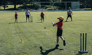 kids trying cricket.jpeg