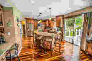 Kitchen installation with kitchen island and stools in a property in Cardiff, South Wales