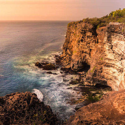 Stunning landscape cliff scene at sunset in Bali, Indonesia, Asia