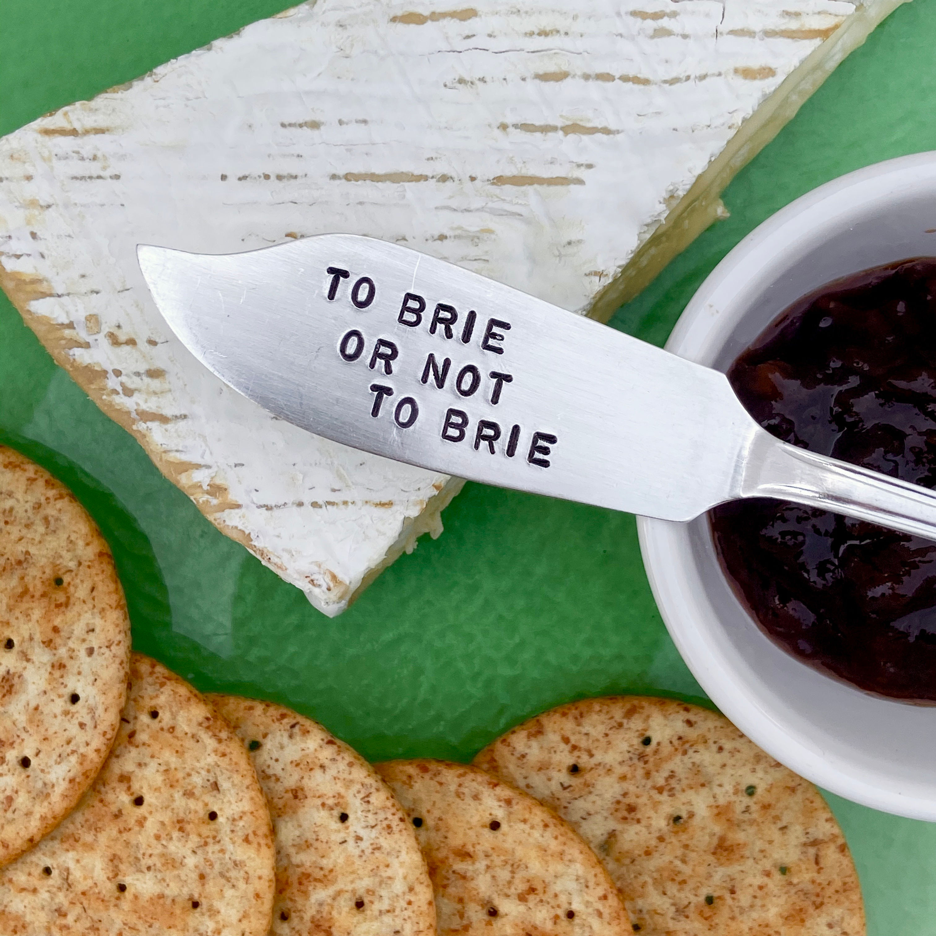 Vintage silver-plated knife hand-stamped with "To Brie Or Not To Brie," a witty and charming gift for cheese lovers.