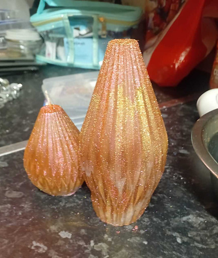 2 orange vase candles