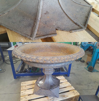 repaired damaged on the base of an urn