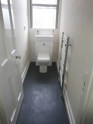 bathroom space with new radiator