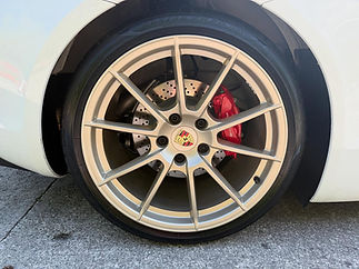 Close up of Porche wheel with new brake callipers
