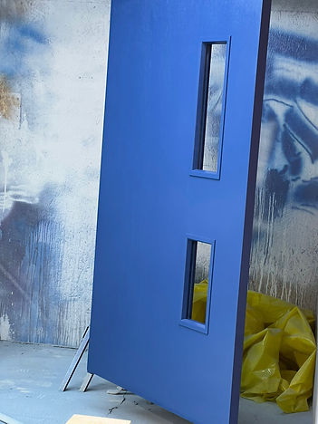 Finished blue bulk fire door blanks with precision cutouts