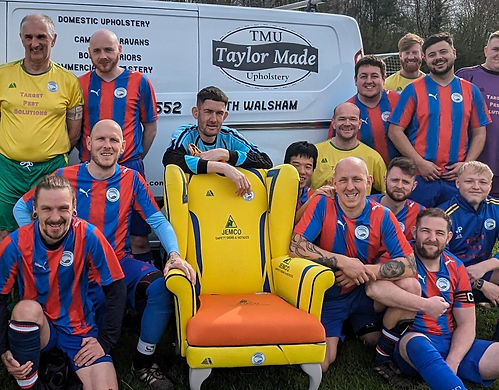 Football team posed around a custom football shirt chair