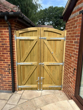 wooden double gate with locks for security