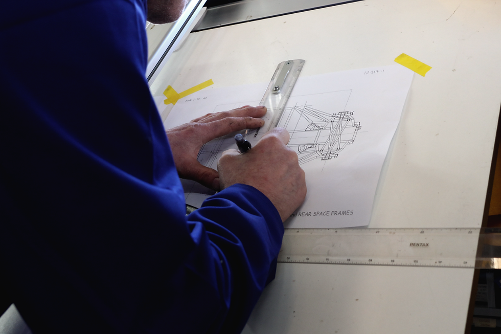 Sneak peek: Allan working at his drawing board, refining his initial chassis design in September, 2025. Rebel Autoworx