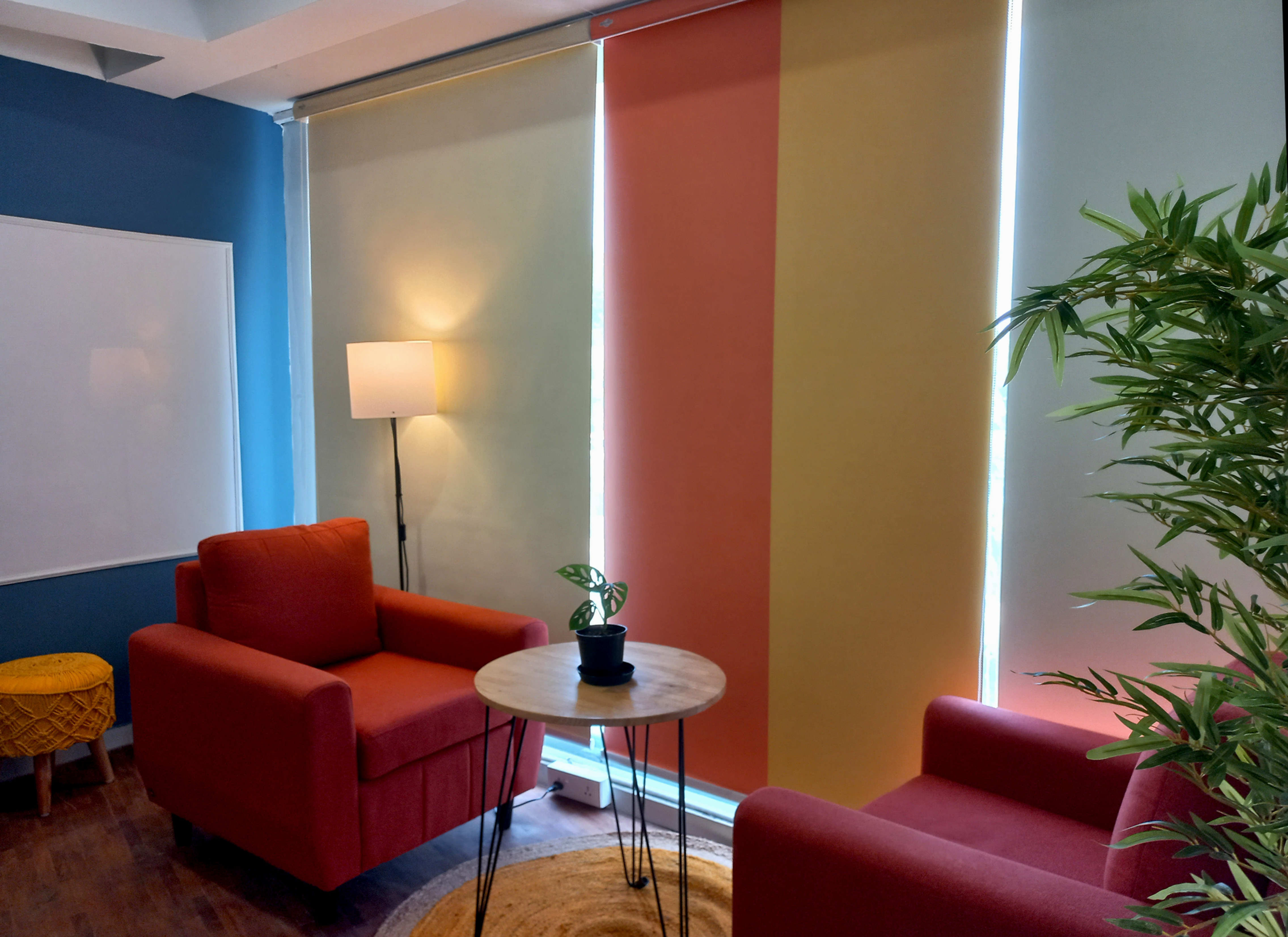 Collaborative space with seating for two, equipped with white board for discussions