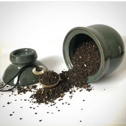 Tea jar with brass scoop.