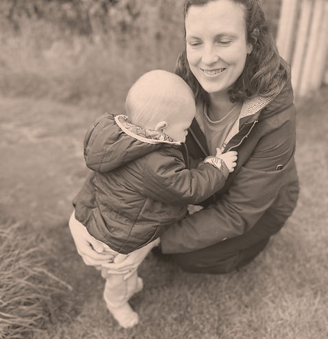 Image of child running into mothers arms