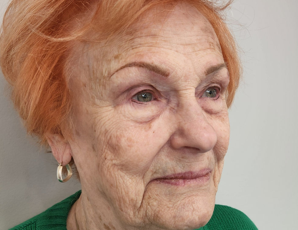 Subtle permanent eyeliner tattoo applied along the lash line to enhance eye definition naturally.