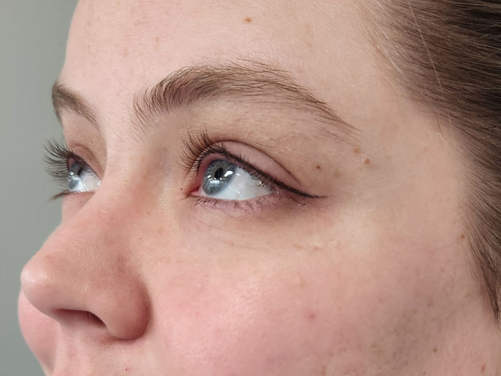 Winged permanent eyeliner tattoo customized to the client’s eye shape for soft, lifted definition.