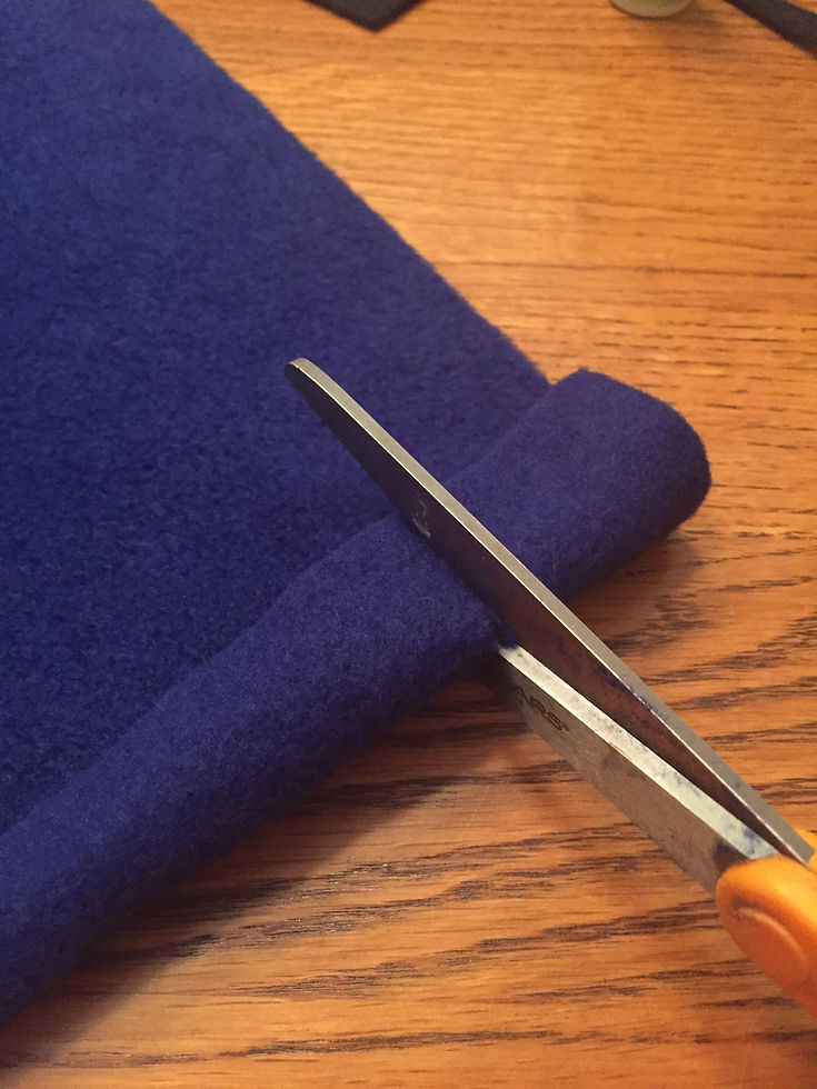 Creating the holes for the superhero cape
