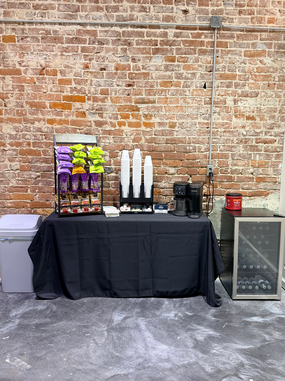 Refreshment station with snacks, coffee, and drinks