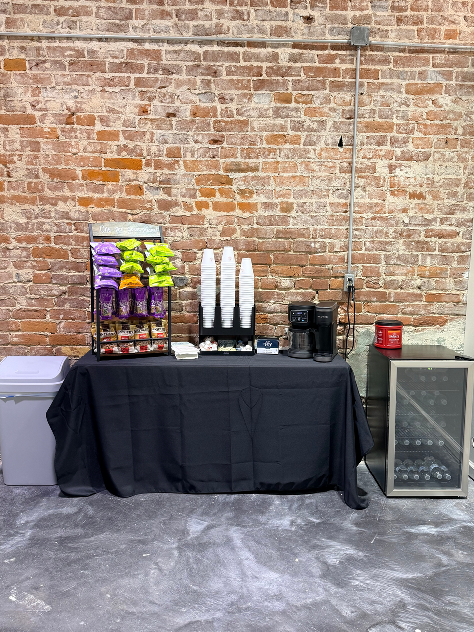 Refreshment station with snacks, coffee, and drinks