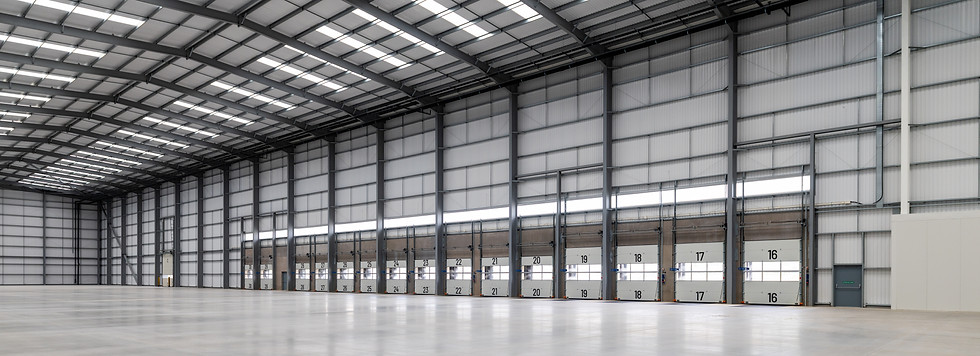 Empty industrial warehouse with high ceilings and metal structure