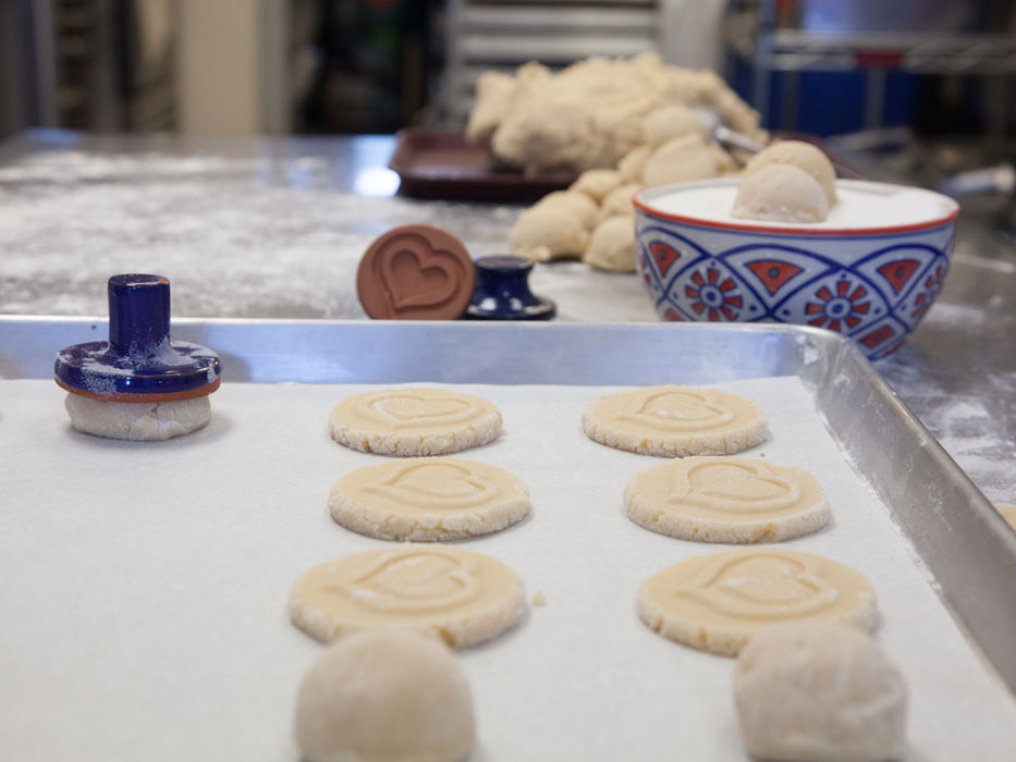 Cookies on tray, Cookie Time Bakery logo visible, kitchen background, baked goods.