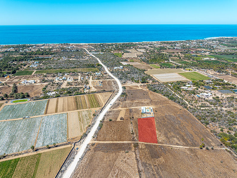 Aerial view of cultivated land, road, sea, and fields in Pescadero
