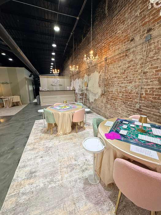 Palette & Play event space with game tables and pastel chairs